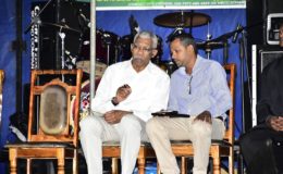 President David Granger (left) makes a point to Regional Chairman,  Vickchand Ramphal during the opening ceremony of the Expo and Trade Fair at the Bath Settlement Community Ground, West Coast Berbice (Ministry of the Presidency photo)