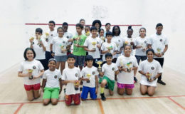 The respective winners and finishers in every category pose with their spoils following the conclusion of the Toucan Distributors Junior Skill Level Squash at the Georgetown Club Facility on Camp Street.