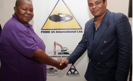 Chief executive officer, Prime US Internation Ltd., Stephanie Bonaparte-Primus , left ,poses for a photo with president and chief executive officer of Wylde Orchid Designs and Management Co. Ltd (Canada) during a joint press conference, Cascadia Hotel, St Ann's yesterday.