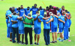 A focused looking West Indies side, in a team huddle before their first practice session at Providence, yesterday. (Orlando Charles photo)