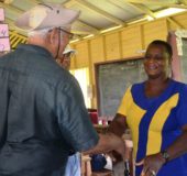 Baracara outreach: Agriculture Minister, Noel Holder while meeting Head Teacher for Baracara Primary School, Kim Sampson during a visit to the Berbice River institution last week. (Ministry of Agriculture photo)
