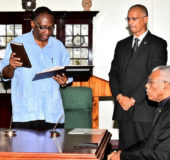 Patrick Yarde reciting the Oath of Office in the presence of President David Granger  (Ministry of the Presidency photo)