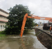 Canal cleaning: Like clockwork, the rainy season has brought with it the frenzied cleaning of canals. This canal near Queen’s College on Camp Road benefitted yesterday. (Photo by Keno George)