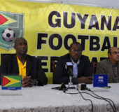Standing firm! Guyana Football Federation President Wayne Forde (centre) addressing the media yesterday in the presence of Executive Committee Member Keith O’Jeer (left), GFF Vice-President Bruce Lovell (2nd from left), GFF Legal Advisor Kalam Juman-Yassin (2nd from right) and Rawlston Adams (right) following’s FIFA declaration that the Disciplinary Committee does not have the authority to rule on policy issues.