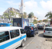 Traffic snarled yesterday around central Georgetown as the Guyana Police Force enforced an extended barricade around Public Buildings during the sitting of the National Assembly. In photo drivers contemplate their next move at the Regent Street barricade. (Photo by Keno George)
