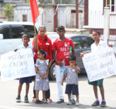 Ali Rasheed with his wife and four of their children at the protest yesterday. 