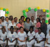Minister of Public Health Volda Lawrence (standing, centre) with the nurses who were awarded for excellence and punctuality, excellence in patient care, years of service, willingness and dedication of service and for maintaining high standards of quality care in nursing. (Ministry of Social Protection photo)
