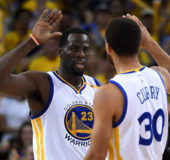 Draymond Green and Stephen Curry celebrate their team’s comeback win.