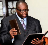 Ombudsman Justice (rtd) Winston Patterson taking the oath of office in May