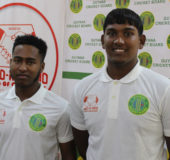 West Indies Under19 selectees Joshua Persaud and Bhaskar Yadram (right) at the launching of the Hand-in-Hand Insurance Under19 Inter– County competition yesterday. The pair will turn out for Demerara before leaving for their tour to Africa. (Royston Alkins photo)