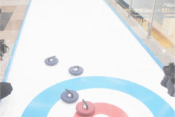 Rayad Husain simulates curling on the iceless rink at the Giftland Mall on Tuesday