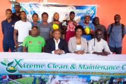 Representatives of the respective competing teams posing alongside members of the Xtreme Clean Gold Rush Futsal Championship launch party. From left to right sitting-Referees Coordinator Wayne Griffith, NSC Chairman Ivan Persaud, Managing Director of Xtreme Clean Shanae Gomes and Troy Clarke