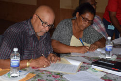 Managing Director of the Guyana Water Incorporated Dr. Richard Van West- Charles and Chairperson of the Matthews Ridge/Arakaka and Port Kaituma NDC Margaret Lambert signing the agreement (GINA photo)