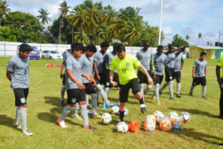 Kristian Heames, coach of the Finland based FF Jaro club going through a drill with members with the National u17 squad during the Scouting and Assessment programme yesterday at the No. #5 ground in West Coast Berbice