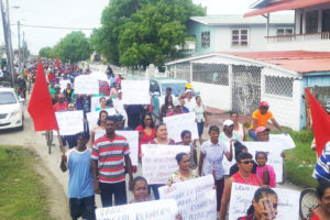 Hundreds of protesters marched yesterday against the planned closure of the Enmore estate (GAWU photo)

