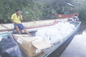 Hampers and other supplies being transported to the village of Kako, Cuyuni-Mazaruni (Ministry of the Presidency photo) 