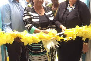 Minister of Public Health Volda Lawrence flanked by Chief City Engineer Colvern Venture (at left) and Mayor Patricia Chase-Green (at right) and Chief Nurse Beryl Springer (at rear) as she cuts the ribbon to reopen the Albouystown Health Centre on Monday. 