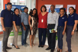 GTT yesterday awarded winners of their recent Mother’s Day Promotion at their Camp and Robb streets outlet. In photo, representatives of GTT and Fly Jamaica  pose with the winners. Clement Sealey (third right) won the grand prize of a trip for two to Jamaica compliments of Fly Jamaica Airways while Hardat Malchand and Venita Ally of Berbice (third and fourth from left) won the consolation prizes of a Samsung S7 Edge each. 
