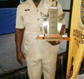 Assistant Superintendent Mitchell Novar Caesar with the trophy he was awarded for being first runner-up Caribbean Crime Fighter of the Year