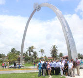 ANSA McAl officials at the commemorative arch, which was donated by the company for Guyana’s 51st Independence Annivesary, after its unveiling yesterday, at Cummings Lodge. (Keno George photo)