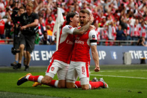 Arsenal’s Aaron Ramsey celebrates scoring their second goal with Hector Bellerin. Reuters / John Sibley