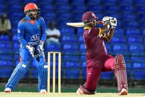 Opener Johnson Charles hits to leg during his half-century against Afghanistan in the Twenty20 warm-up match at Warner Park on Tuesday night. (Photo courtesy WICB Media)