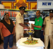 Lindon Henry (third from right), Stag Beer Brand Manager hands over the sponsorship cheque to Guyana Police Force (GPF) Assistant Superintendent of Police Forbes Brown while other members of the launch party including  WDFA President Orin Ferrier (right) and Vice-President Christine Schmidt (second from left) look on.