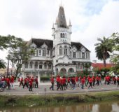 Workers going by the historic City Hall during today's May Day march