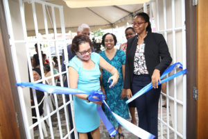 First Lady Sandra Granger cuts the ribbon to the Mercy Resident Care Home, in the official commissioning of the building.