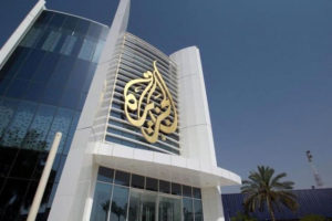 The Al Jazeera Media Network logo is seen on its headquarters building in Doha, Qatar June 8, 2017. REUTERS/Naseem Zeitoon - RTX39N4R 