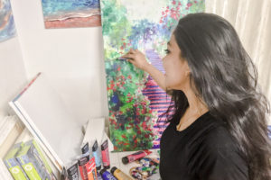 Naeema Bacchus at work on one of her pieces.
