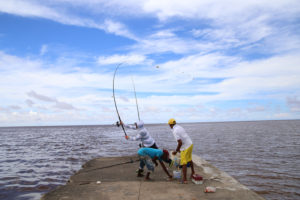 Stabroek News Photographer Keno George captured this trio fishing at the Kingston Jetty yesterday