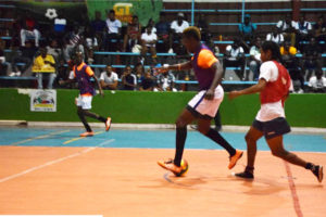 Flashback-Sophia?s Dwayne Lowe challenging Keon Sears of Dave and Celina’s All-Stars during the elimination round in the Xtreme Cleaners?/GT Beer Futsal championships at the National Gymnasium. 