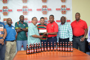 President of the GRFU, Peter Green receiving the sponsorship pact from Banks Beer Brand Manager, Brian Nedd (Orlando Charles photo)