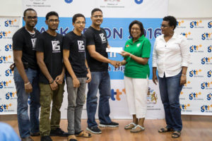 Team V75 receiving the winner’s cheque from Minister Cathy Hughes.