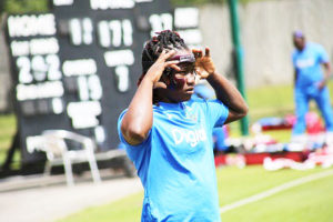 West Indies Women star Deandra Dottin adjusts her face mask during a training session at the Ageas Bowl. (Photo courtesy CWI Media)