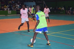 Eusi Phillips (centre) of Sparta Boss receiving a pass while being pursued by Jamal Cozier of Future Stars during their quarterfinal clash at the National Gymnasium in the Xtreme Cleaners/GT Beer Futsal Championships.
