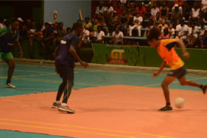 Tucville’s Delon Williams (left) defending against an attacking foray from Sophia’s Dwayne Lowe (right) during their semi-final fixture at the National Gymnasium in the Xtreme Cleaners/Gt Beer Futsal Championship