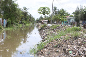 Canal cleaned: Despite the presence of squatters along the canal in Hunter Street, Albouystown, it was recently cleared. This photo taken by Keno George yesterday, shows the stuff that was removed from it piled up along its banks. 