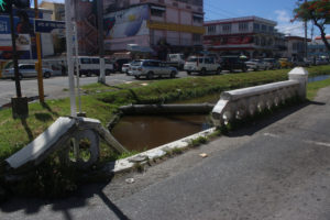 The rails of these bridges along Croal Street, at corners of Avenue of the Republic and Cummings and Light streets were damaged in vehicular crashes, just one of which was recent. Who will fix them? And when will they be fixed? (Photos by Keno George) 