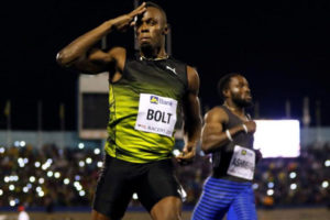 Jamaica’s Olympic champion Usain Bolt (L) gestures after winning his final 100 meters sprint at the 2nd Racers Grand Prix at the National Stadium in Kingston, Jamaica June 10, 2017 (REUTERS/Gilbert Bellamy)
