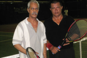 Omar Persaud, left and Godfrey Lowden  won the over 45 men’s  doubles match against Albert Razick and Steve Surujbally.