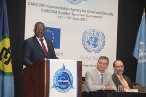 Minister of National Security Edmund Dillon delivers an address during the formal opening of CARICOM Counter Terrorism Strategy two day conference held at Hyatt Regency Hotel yesterday. Looking on, from second left, are United Nations Resident Coordinator & UNDP Resident Representative T&T Richard Blewitt and CARICOM Secretary General and Chief Executive Officer Ambassador Irwin Larocque.