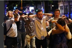 People leave the area with their hands up after an incident near London Bridge in London, Britain June 4, 2017. REUTERS/Neil Hall