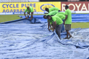Ground-staff engage in mop-up operations during last Friday’s rain-affected opening ODI. (Photo courtesy CWI Media) 