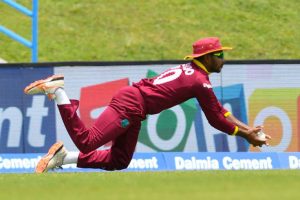 Guyana’s Devendra Bishoo takes a diving catch to dismiss Ajinkya Rahane. (Photo Cricket West Indies)
