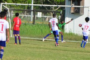 Morgan Learning Centre (white) scoring their first of eight goals against Cummings Lodge Secondary in the 7th Annual Digicel Schools Football Championship at the Ministry of Education ground. (Orlando Charles photo)
