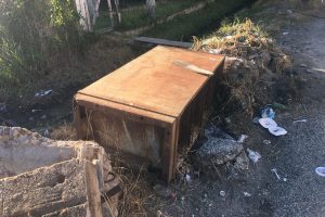 This metal filing cabinet, which was initially in the drain, has been lying on the side of Alexander Street for more than a month