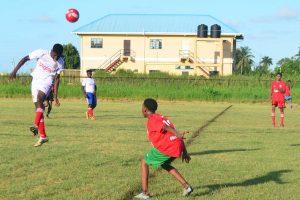 Action between St. George’s and GTI in the 7th Annual Digicel Schools Football Championship at the Ministry of Education ground yesterday. (Orlando Charles photo).