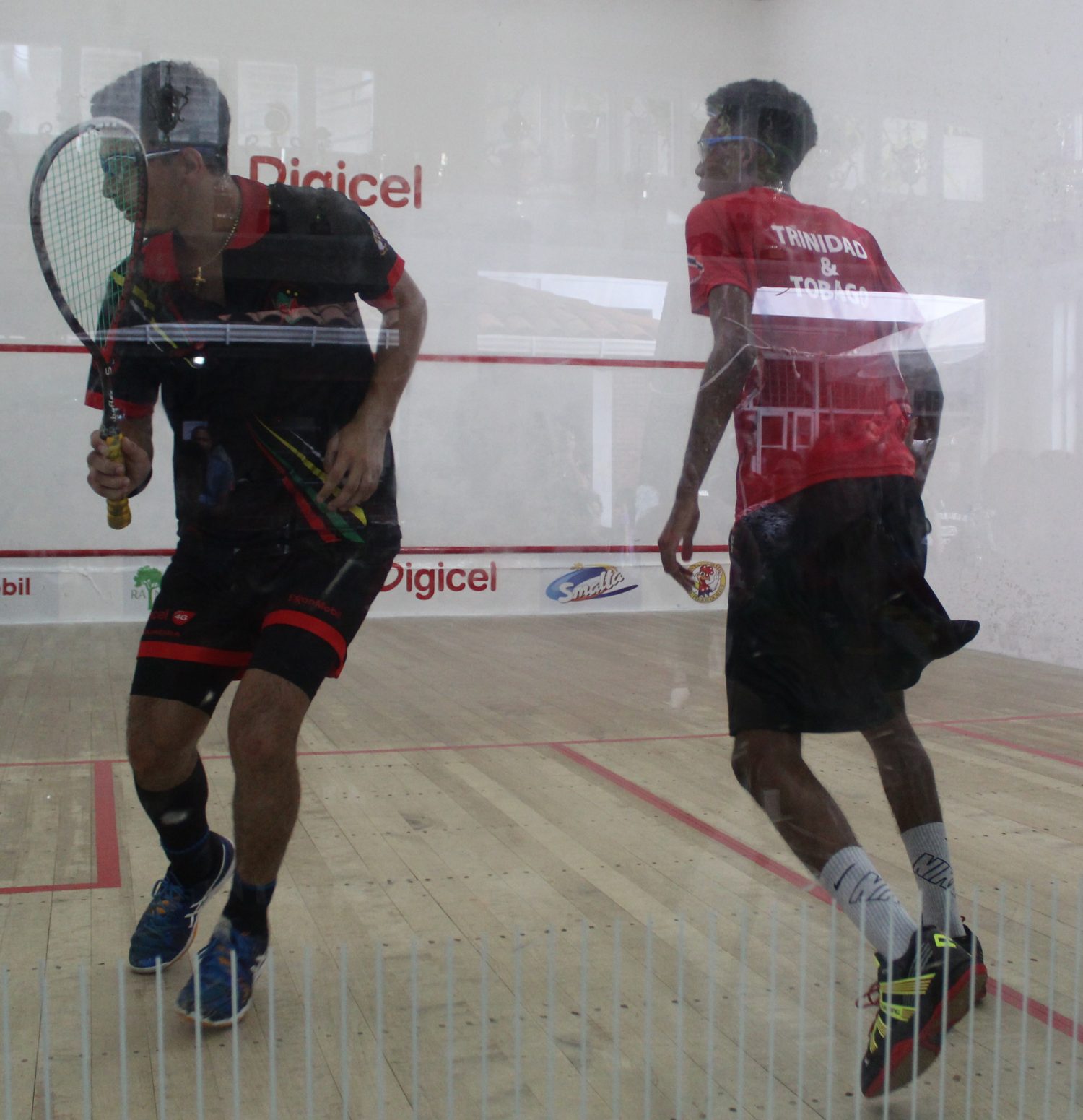 Guyana’s Captain Benjamin Mekdeci (left) was in fine form whilst easing pass Trinidad’s Nicolas Caddle, 11-4, 11-3, 11-6 yesterday morning at the Georgetown Club (Royston Alkins Photo)
